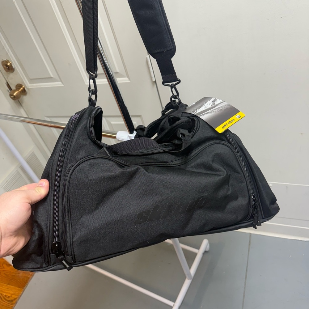 Black Duffel Bag with Adjustable Strap and Durable Fabric